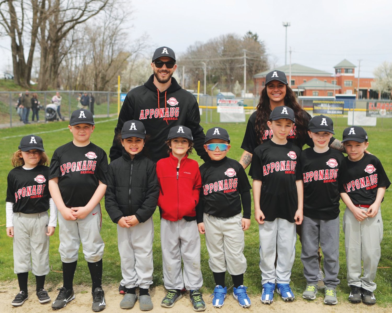TEAM WORK: Apponaug’s Northeast Baseball Training team gathers for a group photo prior to the first pitch on Opening Day last Saturday at the league’s complex in Warwick.